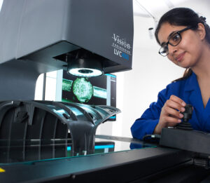 Female technician operating LVC 400 metrology measuring system